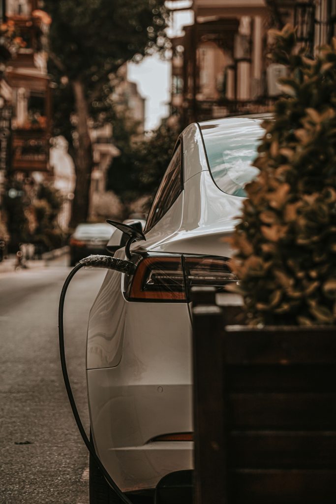 Electric car charging at a station