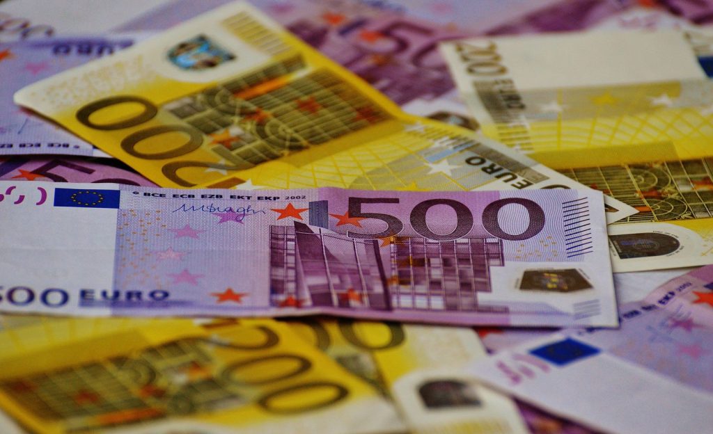 Euro banknotes stacked together