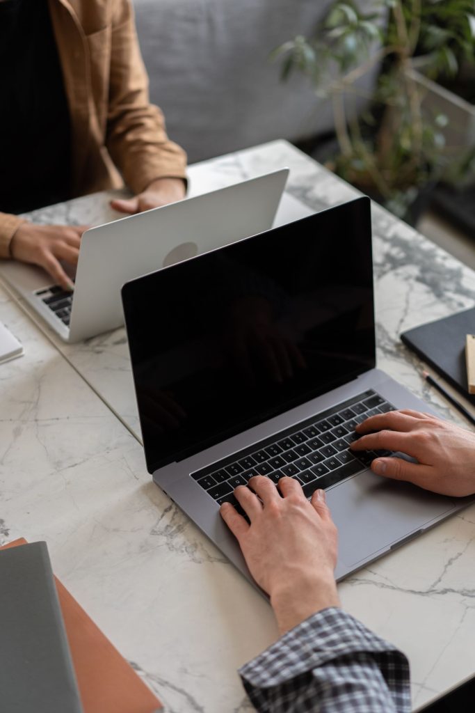 Person working on a laptop in an office