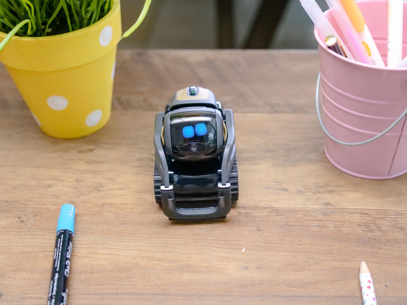 Futuristic AI robot assistant on a desk